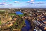 Lichfield cathedral stands beside the river Trent in a cityscape