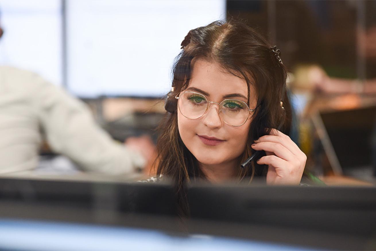 Sanctuary staff member answering a call using a headset Sanctuary staff member answering a call using a headset